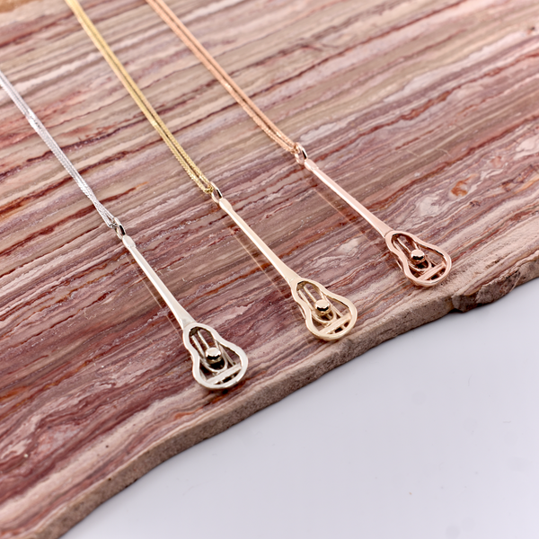 10kt gold modern Lacrosse player's pendant – Sapling & Flint